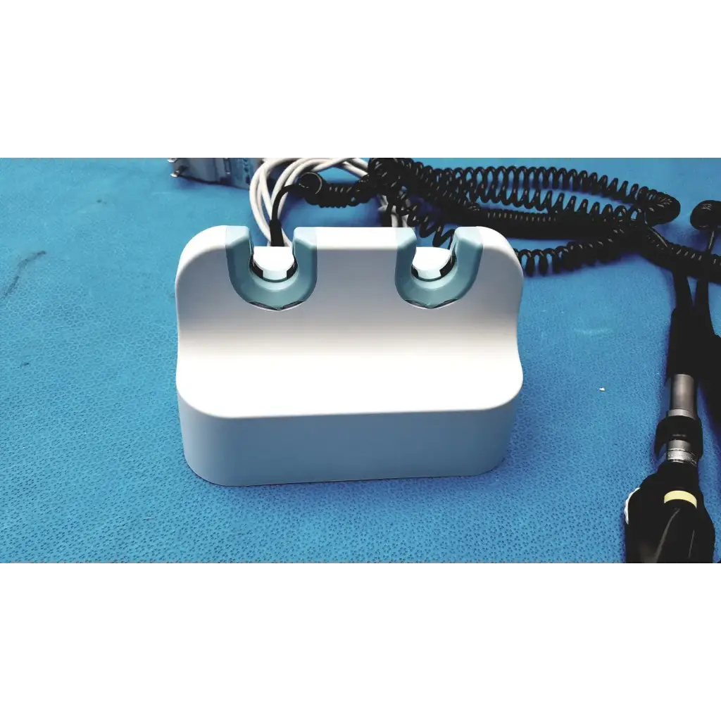Welch allyn GS 777 wall transformer reuse medical device white plastic with light blue accents and two curved slots