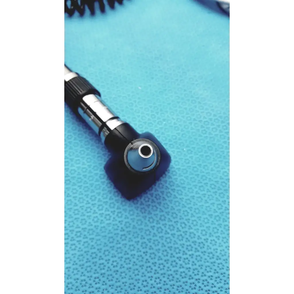 Black and silver welch allyn otoscope with coiled cord for wall transformer reuse medical applications