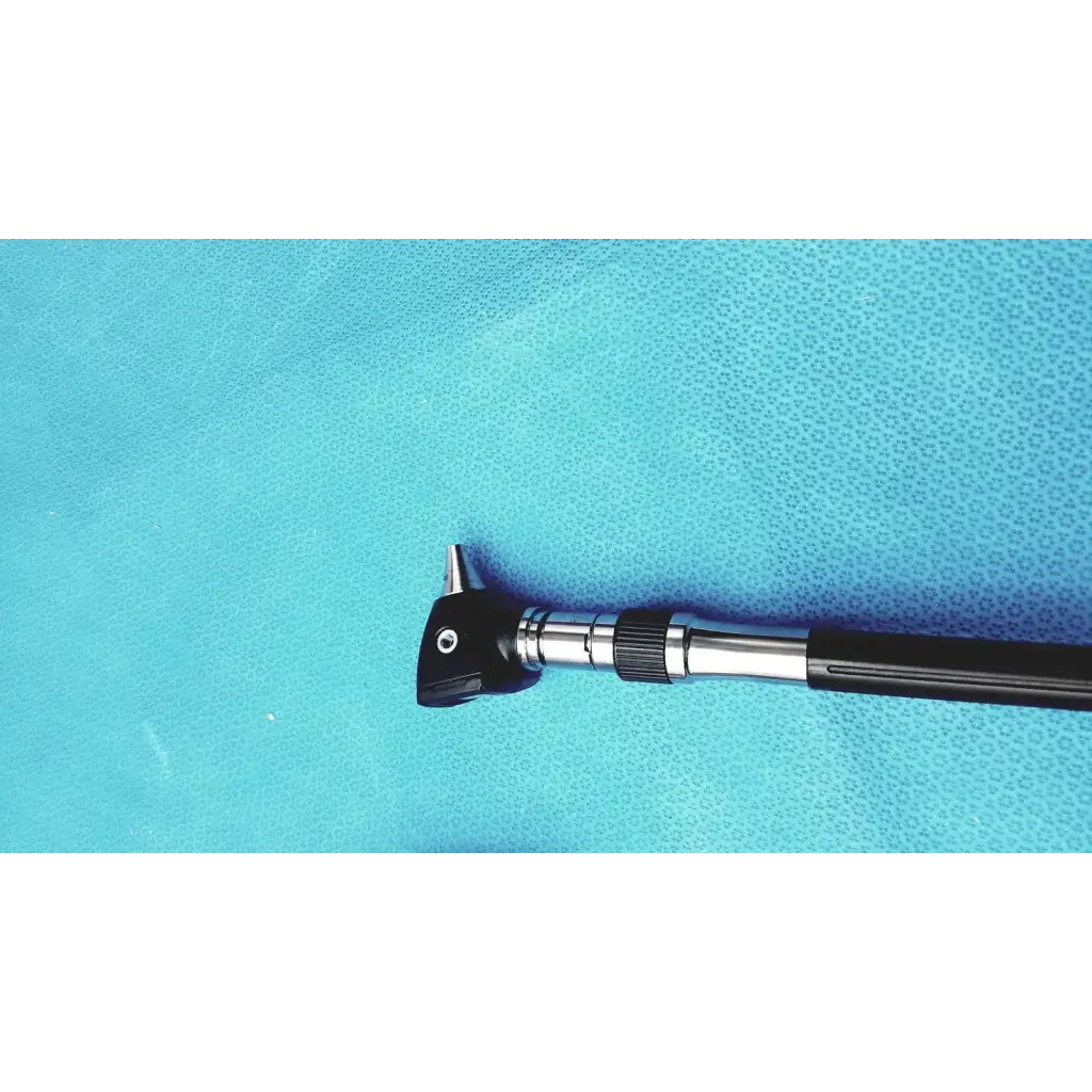 Welch allyn wall transformer with black and silver otoscope featuring a textured grip handle for reuse medical use