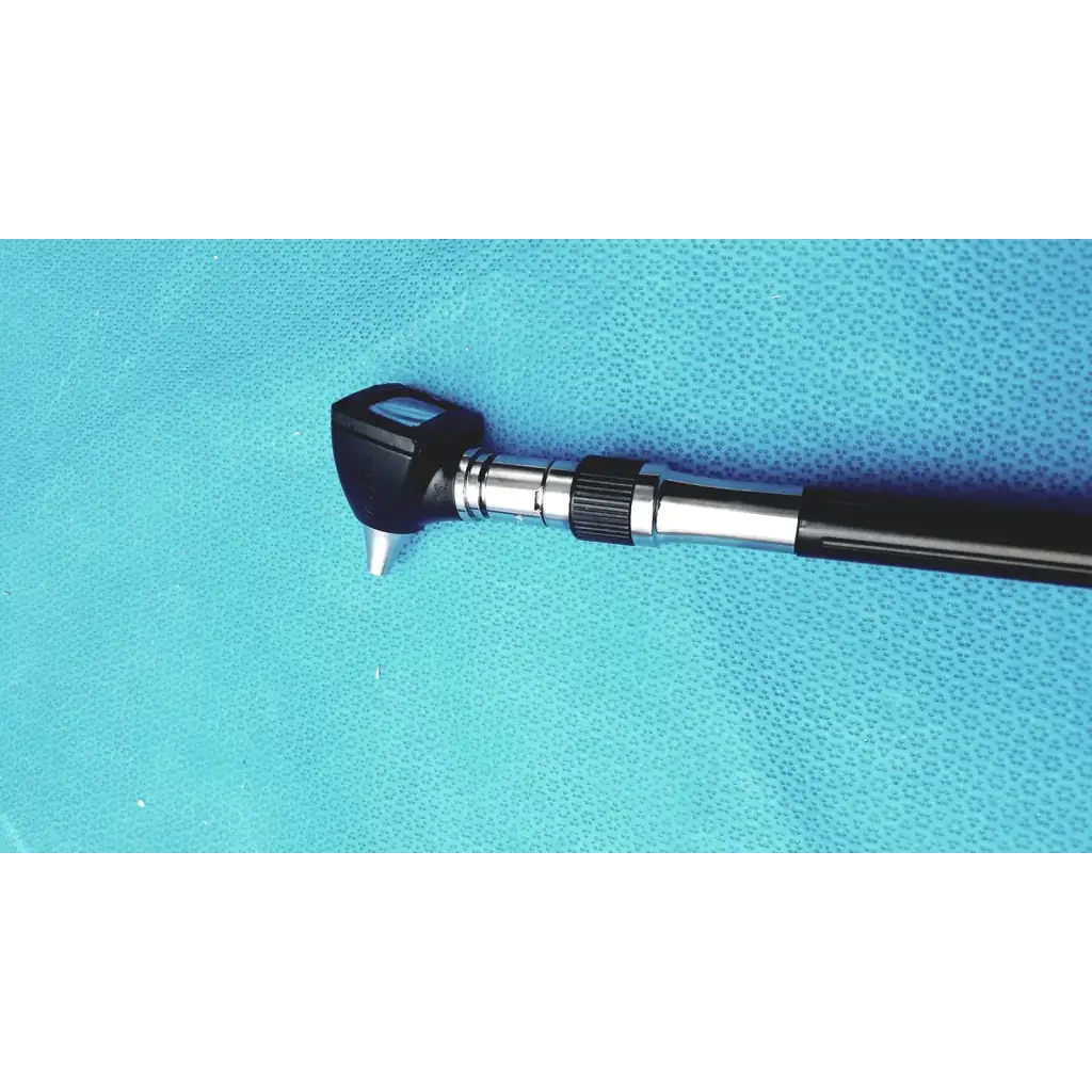 Welch allyn wall transformer ophthalmoscope otoscope with black and silver textured grip and angled tip otoscope