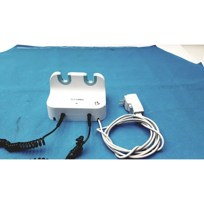 White plastic welch allyn gs 777 wall transformer with blue curved slots and black coiled cords for ophthalmoscope otoscope