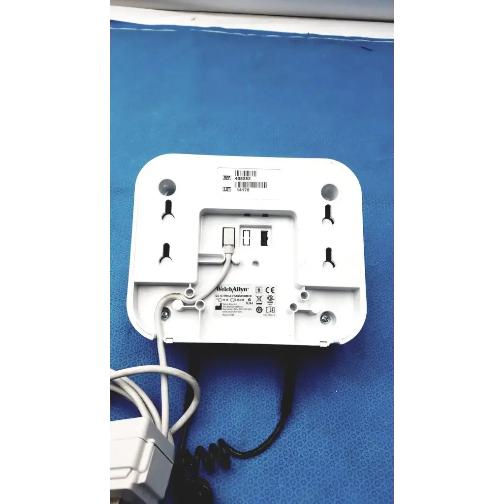 White plastic welch allyn gs 777 wall transformer with ophthalmoscope otoscope wireless coiled cable and power adapter