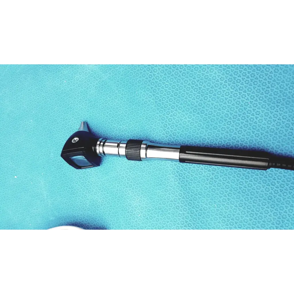 Black and silver welch allyn ophthalmoscope otoscope with textured grip handle, part of gs 777 wall transformer system