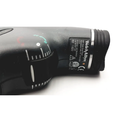 Black welcalivin stun gun with textured grip and silver accents shown with welch allyn panoptic ophthalmoscope 11820