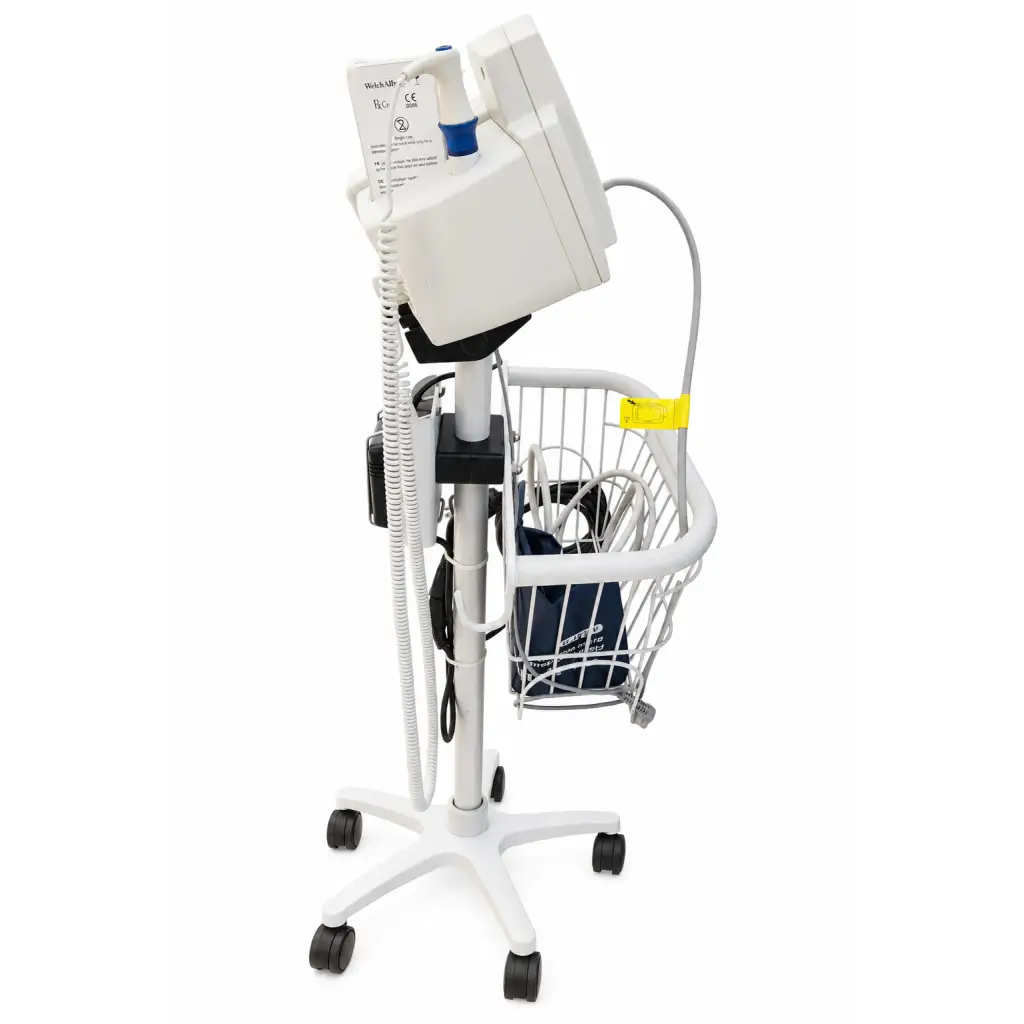 White welch allyn vital signs monitor mounted on wheeled cart with wire basket and accessories