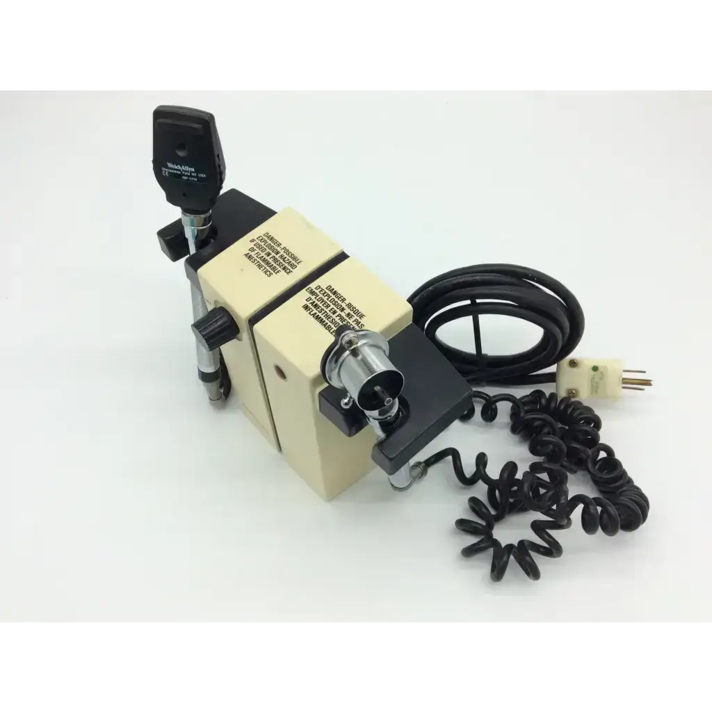 Beige and black medical diagnostic set ophthalmoscope with coiled black cord in welch allyn wall transformer 74710