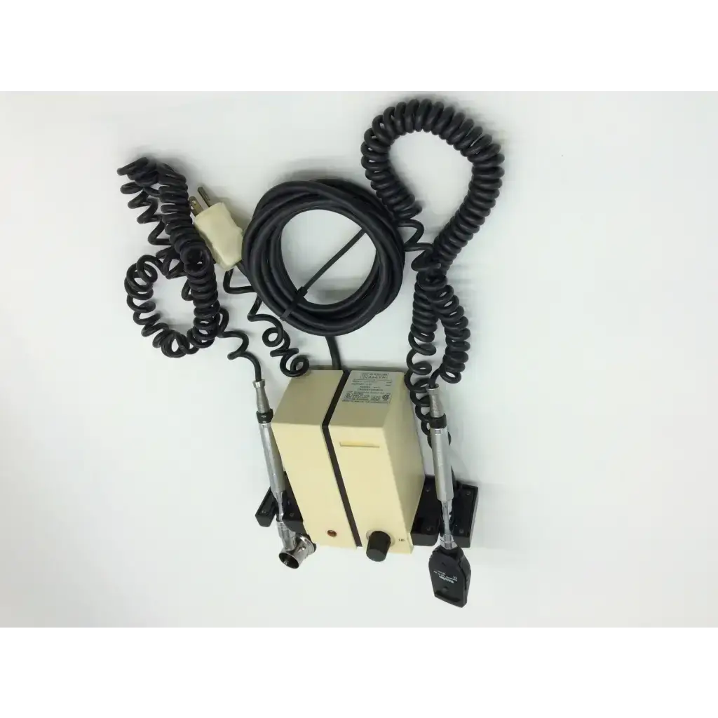 Beige rectangular welch allyn wall transformer with black coiled cables and two metallic probes for diagnostic set ophthalmoscope
