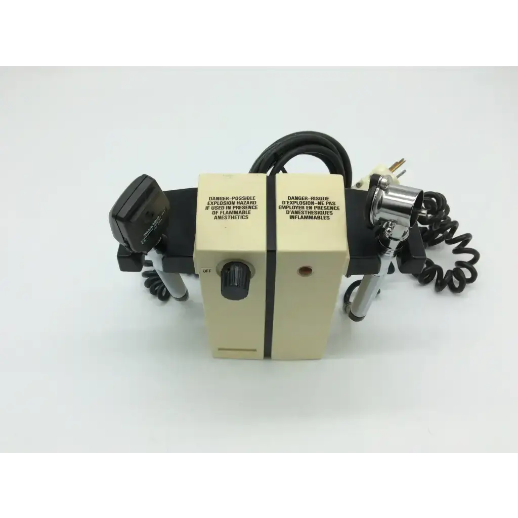 Beige welch allyn wall transformer with black silver components and english french warning labels for diagnostic set ophthalmoscope