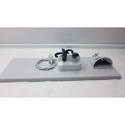 Gray plastic mounting plate with integrated power adapter coiled cable and black electronic components for welch allyn wall transformer diagnostic set