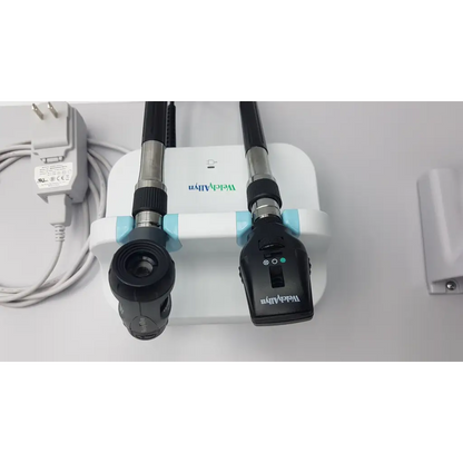 Black and silver welch allyn diagnostic set with wall transformer otoscope ophthalmoscope mounted on white base