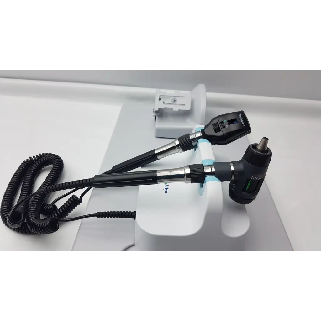 Black and silver welch allyn otoscope with coiled cord branded otoscope for wall transformer diagnostic set use