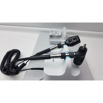 Black and silver welch allyn otoscope with coiled cord branded otoscope for wall transformer diagnostic set use
