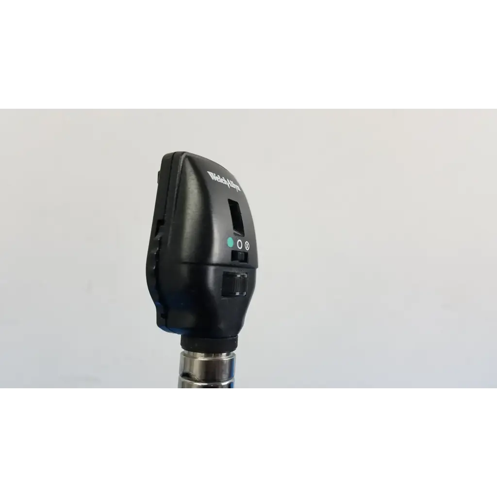 Black Welch Allyn otoscope with metallic shaft and control buttons as part of Welch Allyn wall transformer set