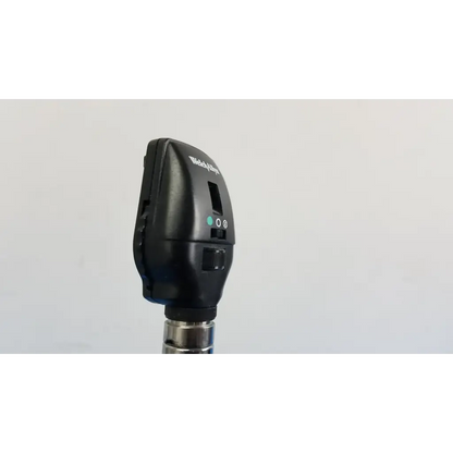 Black Welch Allyn otoscope with metallic shaft and control buttons as part of Welch Allyn wall transformer set
