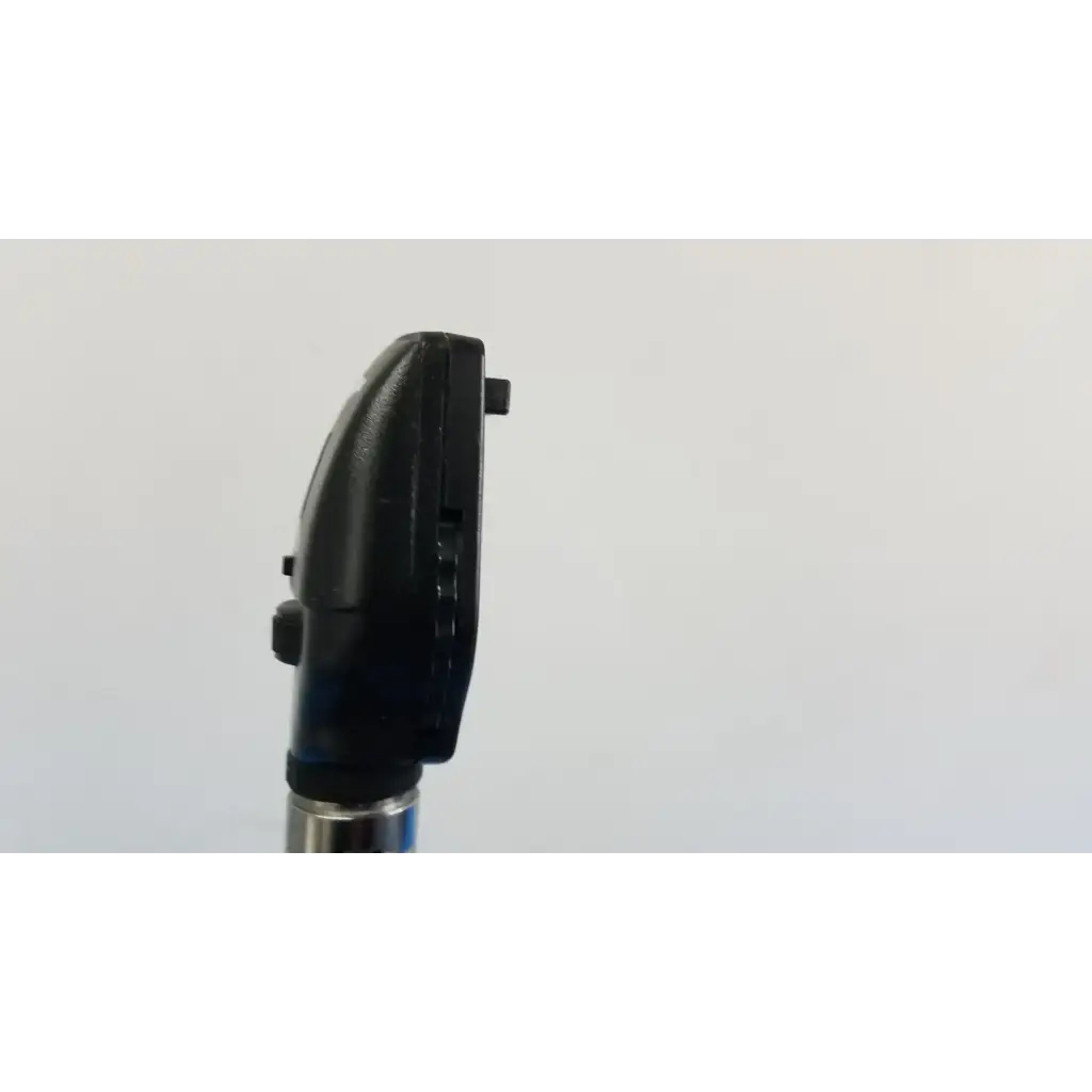 Black plastic welch allyn otoscope with textured grip and metallic shaft for wall transformer use