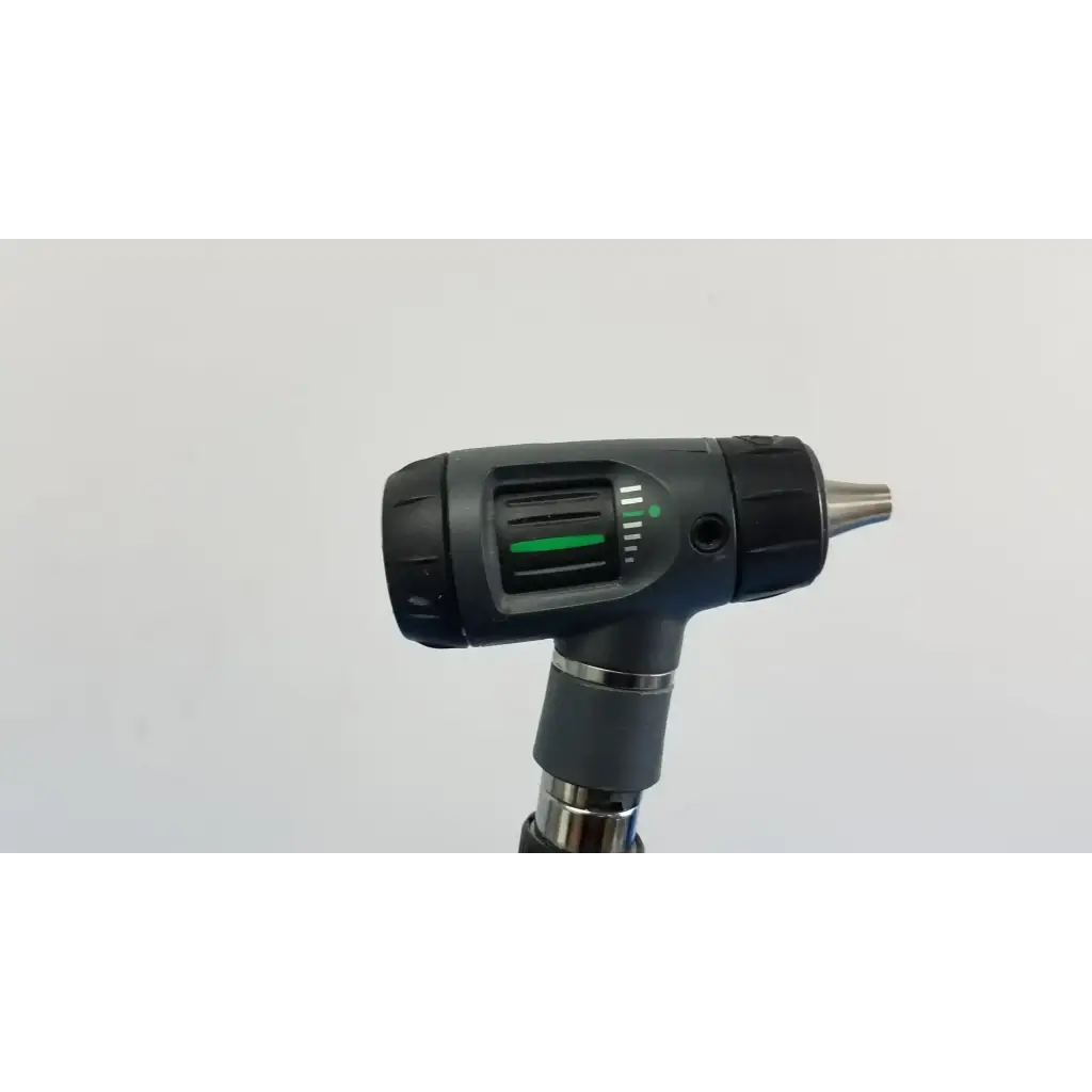 Black and silver cordless drill with green power indicator light next to welch allyn wall transformer with 11720 heads