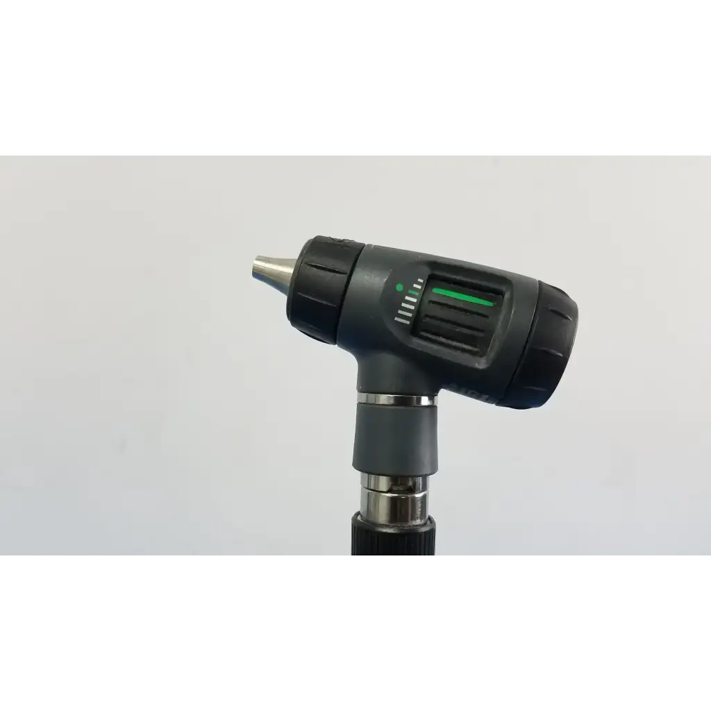 Black and silver Welch Allyn wall transformer otoscope with green illuminated indicator light on handle for medical use