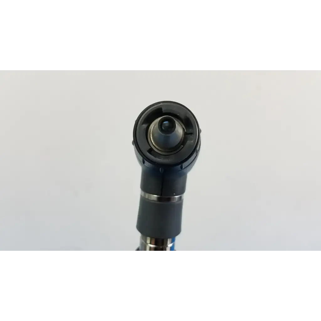 Black rubberized grip with metallic accents and circular adjustable head on welch allyn wall transformer product