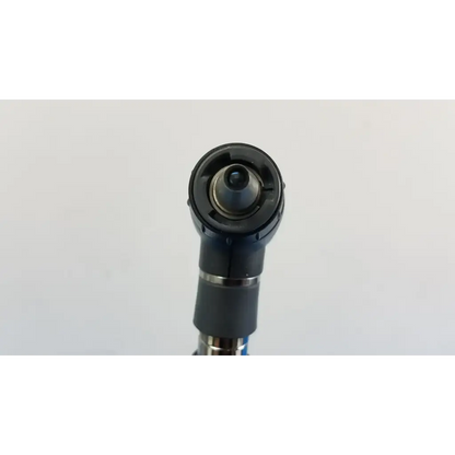 Black rubberized grip with metallic accents and circular adjustable head on welch allyn wall transformer product