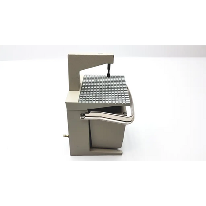 Industrial-grade metal band saw with gray frame and grid cutting surface for whaledent pindex dental laser drilling use