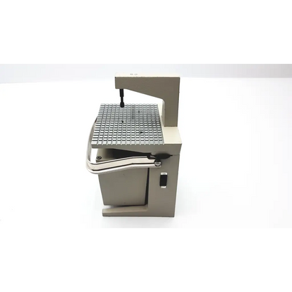 Industrial-grade metal band saw with grid work surface and gray frame for whaledent pindex dental laser drilling system
