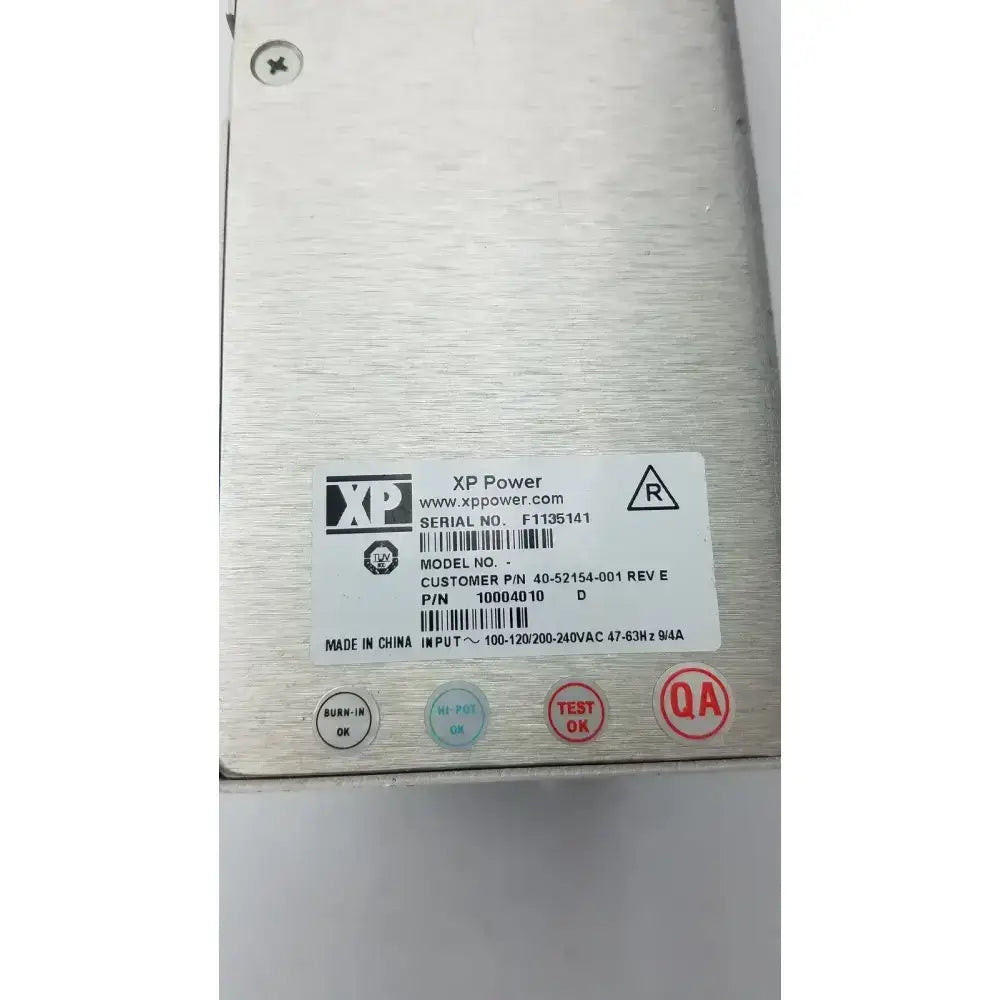 Silver brushed metal xp power rev e power supply unit with white label showing model 40-52154-001 and serial no f1135141