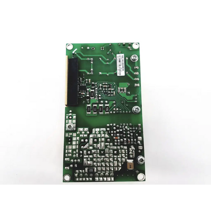 Green rectangular open frame circuit board with silver soldered components and barcode label for power ecm100us24