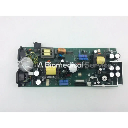 Green circuit board with yellow capacitors and blue inductors for z-axis 320468000 rev b power board