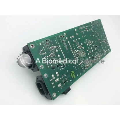 Green printed circuit rev b power board z-axis with silver solder joints black connectors and a small spherical sensor