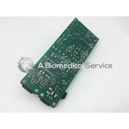 Green rectangular rev b power board z-axis with silver solder points and black connectors on a circuit board
