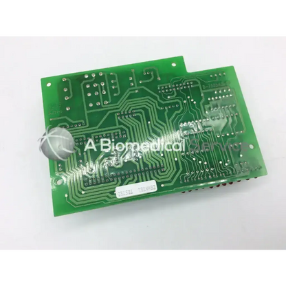 Green rectangular zehntel f-758543-51 board with silver solder points and intricate copper traces for electronic use
