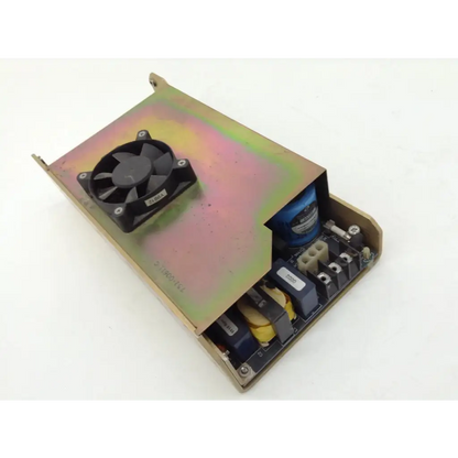 Black fan mounted on metallic housing with internal circuitry and capacitors in zeiss humphrey analyzer dc power 751-00611c
