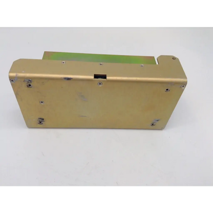 Gold-colored rectangular metal zeiss humphrey analyzer dc power supply 751-00611c with screws and black slot on top