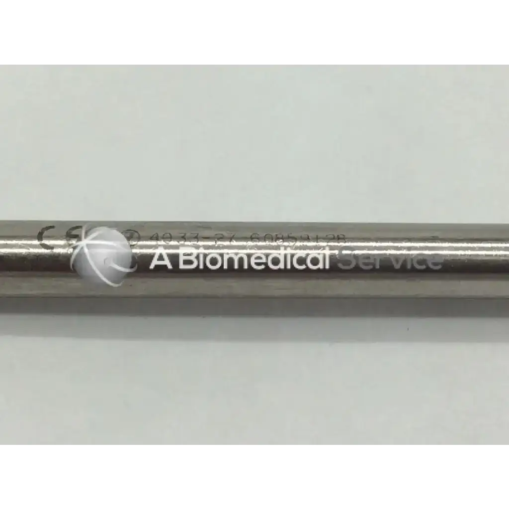 Zimmer 4033-27 pin retractor is a sleek metallic cylindrical tool with engraved markings and a biomedical service logo