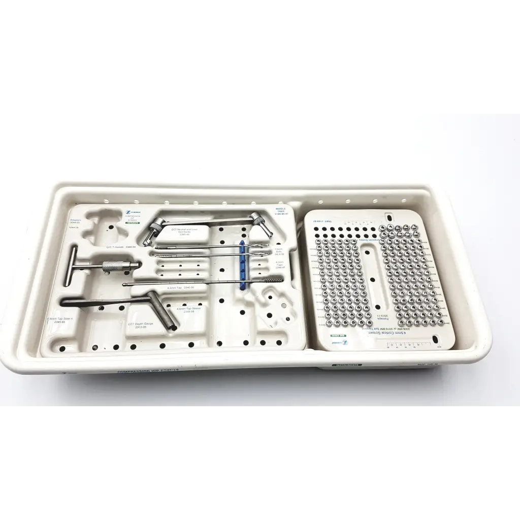 Sterilized metallic zimmer compression hip screws kit with organized surgical tools and screws in molded tray compartments