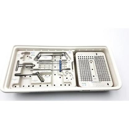 Sterilized metallic zimmer compression hip screws kit with organized surgical tools and screws in molded tray compartments