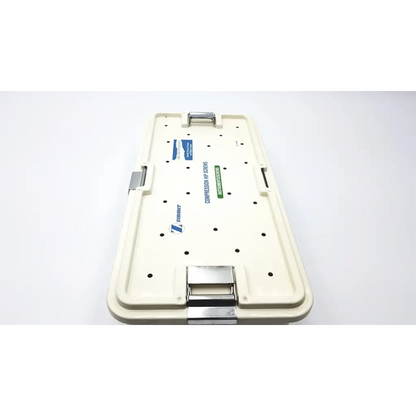 Cream-colored plastic zimmer compression hip screws kit with metallic latches for orthopedic hip fixation use