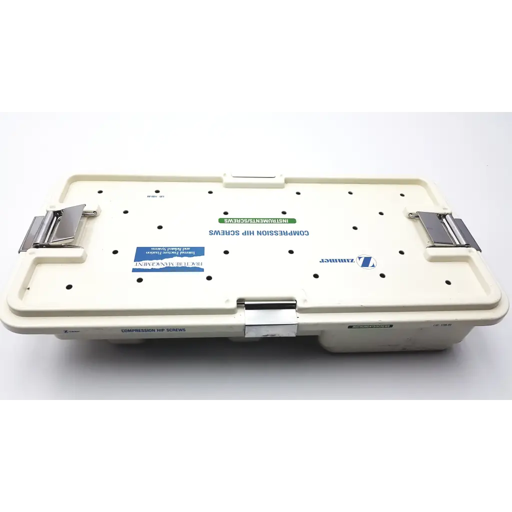 Cream-colored plastic zimmer compression hip screws kit case with metallic latches and zimmer brand label