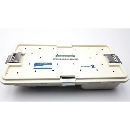 Cream-colored plastic zimmer compression hip screws kit case with metallic latches and zimmer brand label