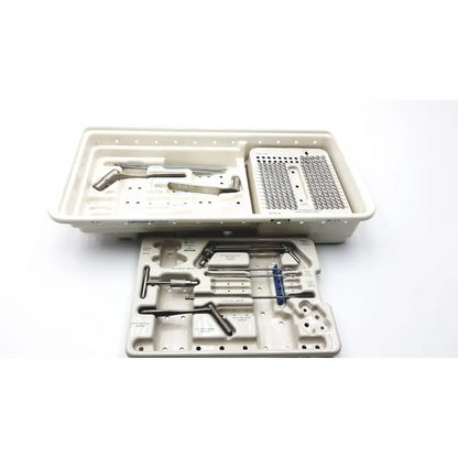 Sterilized zimmer compression hip screws kit with metallic instruments and implants in a beige plastic tray organizer