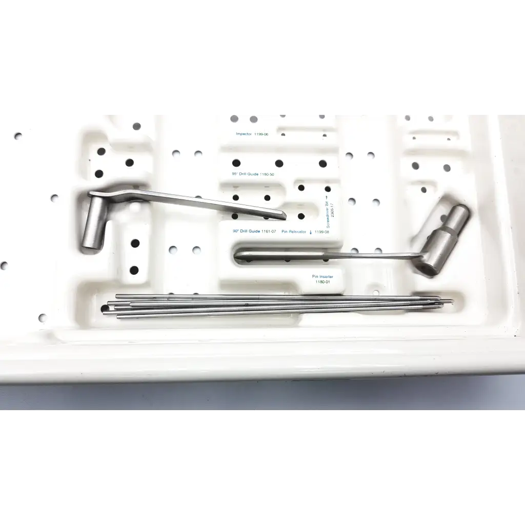 Stainless steel zimmer compression hip screws kit with precision instruments and drill bits in white molded tray