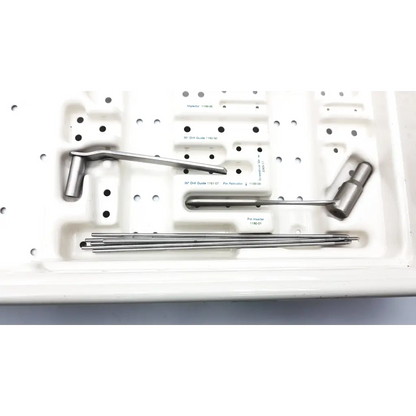 Stainless steel zimmer compression hip screws kit with precision instruments and drill bits in white molded tray