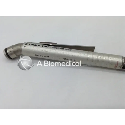 Silver metallic Zimmer Hall surgical micro 100 sagittal saw orthopedic instrument with textured grip and engraved branding