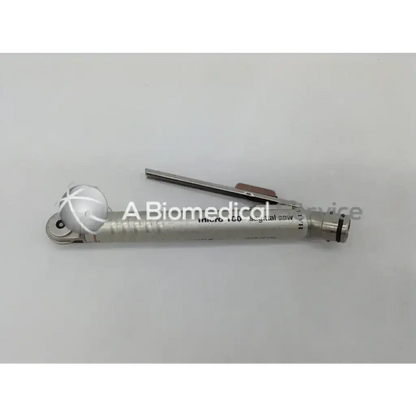 Silver metallic surgical micro sagittal saw with circular blade and engraved zimmer hall branding for orthopedic use