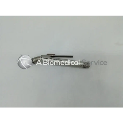 Silver surgical micro 100 sagittal saw with spherical handle and white crosshatch markings by zimmer hall orthopedic