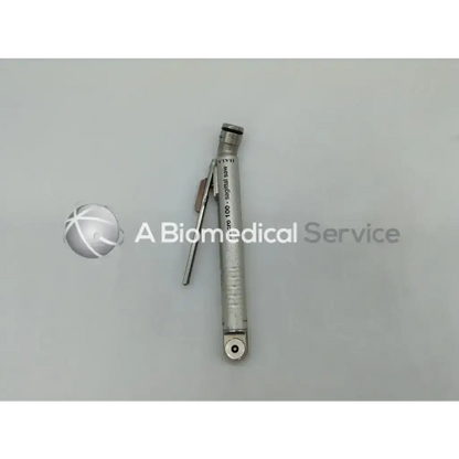 Silver metallic zimmer hall surgical micro orthopedic sagittal saw with retractable blade and engraved text on body
