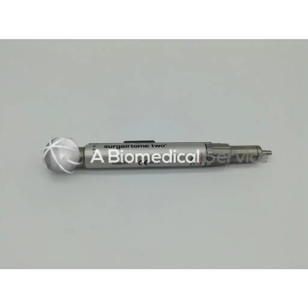 Silver metallic surgairtome two with spherical cross-hatched head in zimmer linvatec hall micro 100 pneumatic set