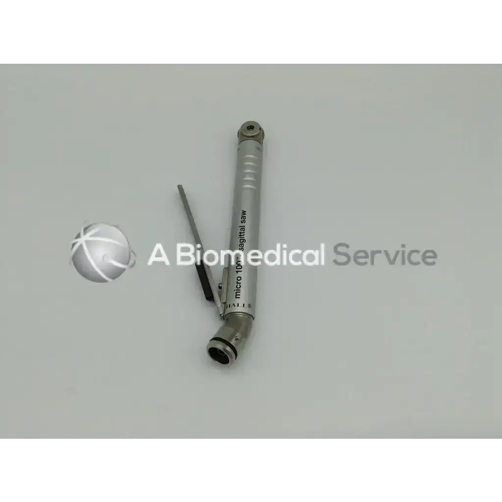 Silver metallic micro 10mm sagittal saw with sleek cylindrical body in zimmer linvatec hall micro 100 pneumatic set with surgairtome two