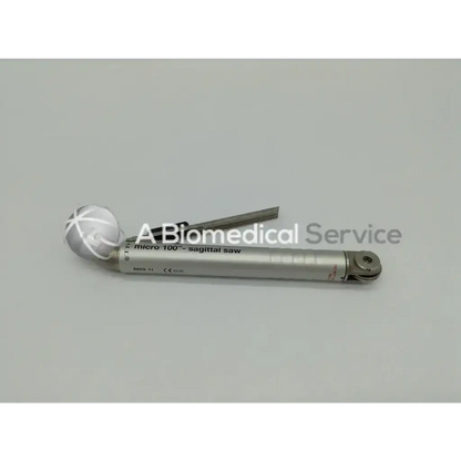 Silver-colored micro 100 sagittal saw with spherical handle and metallic blade from zimmer linvatec hall surgairtome two set