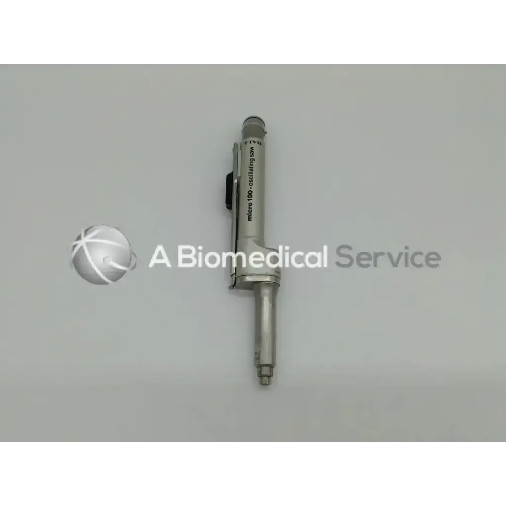Silver metallic zimmer linvatec hall micro 100 oscillating saw with black grips in surgairtome two pneumatic set